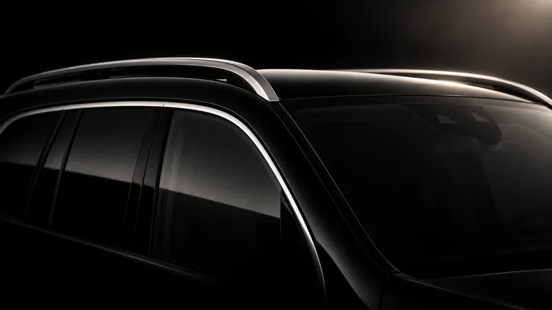 Abstract Mercedes-Benz GLS roofline and window silhouette in silver light.